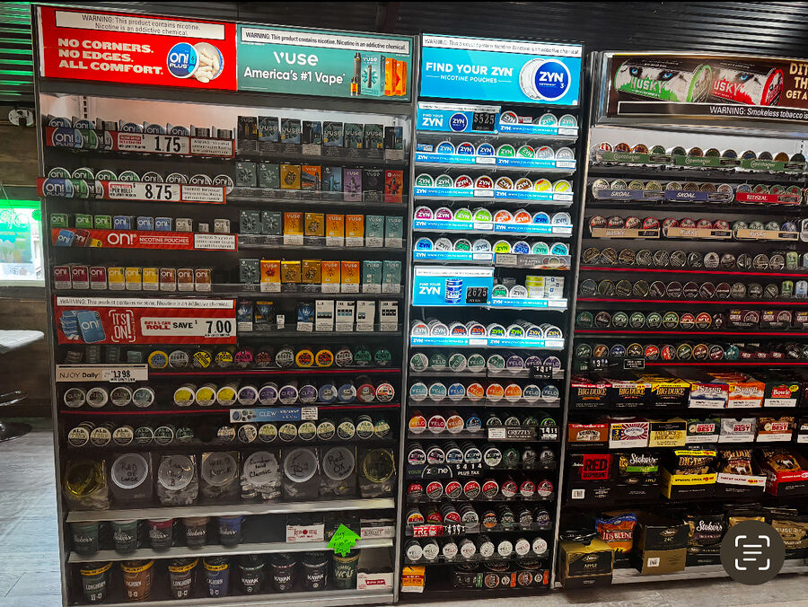 Colorful wall of vapes and nicotine pouches