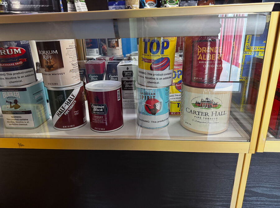 Pipe tobacco tins and roll-your-own supplies